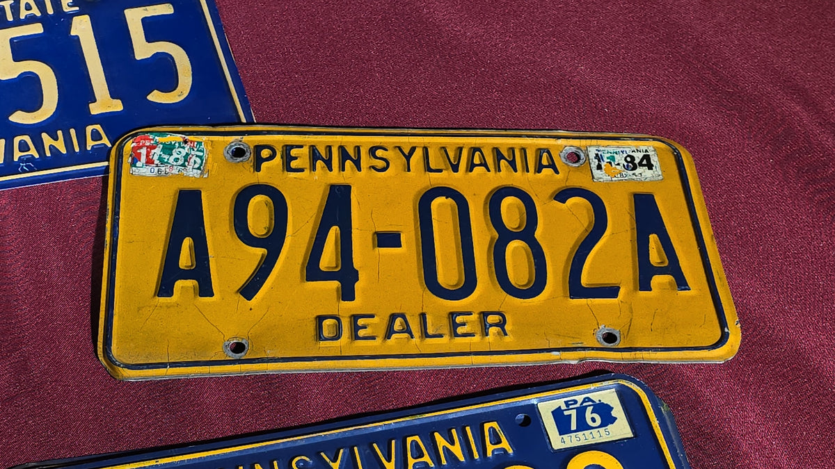Grouping of Seven Vintage Pennsylvania License Plates including Bicentennial and Dealer Plates, 1970s–1980s