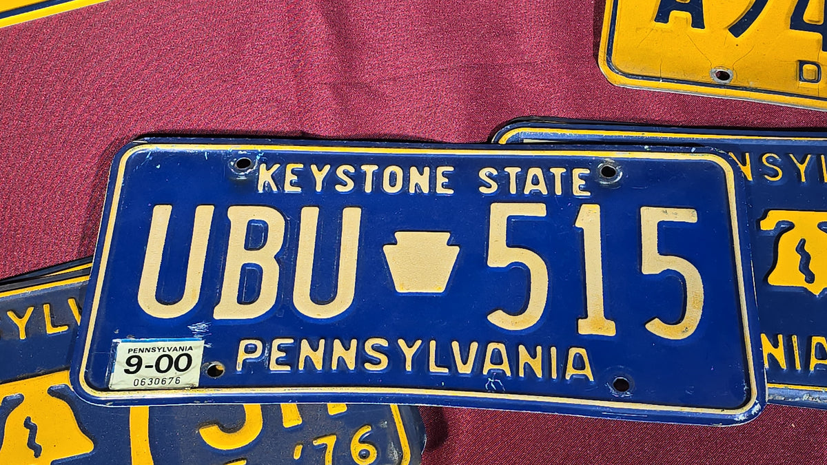 Grouping of Seven Vintage Pennsylvania License Plates including Bicentennial and Dealer Plates, 1970s–1980s