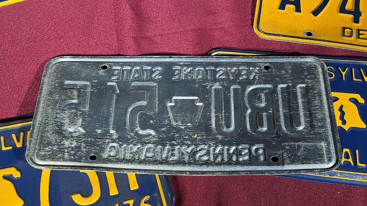 Grouping of Seven Vintage Pennsylvania License Plates including Bicentennial and Dealer Plates, 1970s–1980s