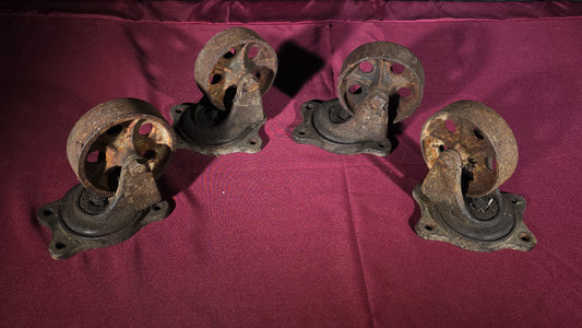 Grouping of Four Antique Cast Iron Industrial Caster Wheels, Manufactured by Service Caster Co., Albion, Michigan
