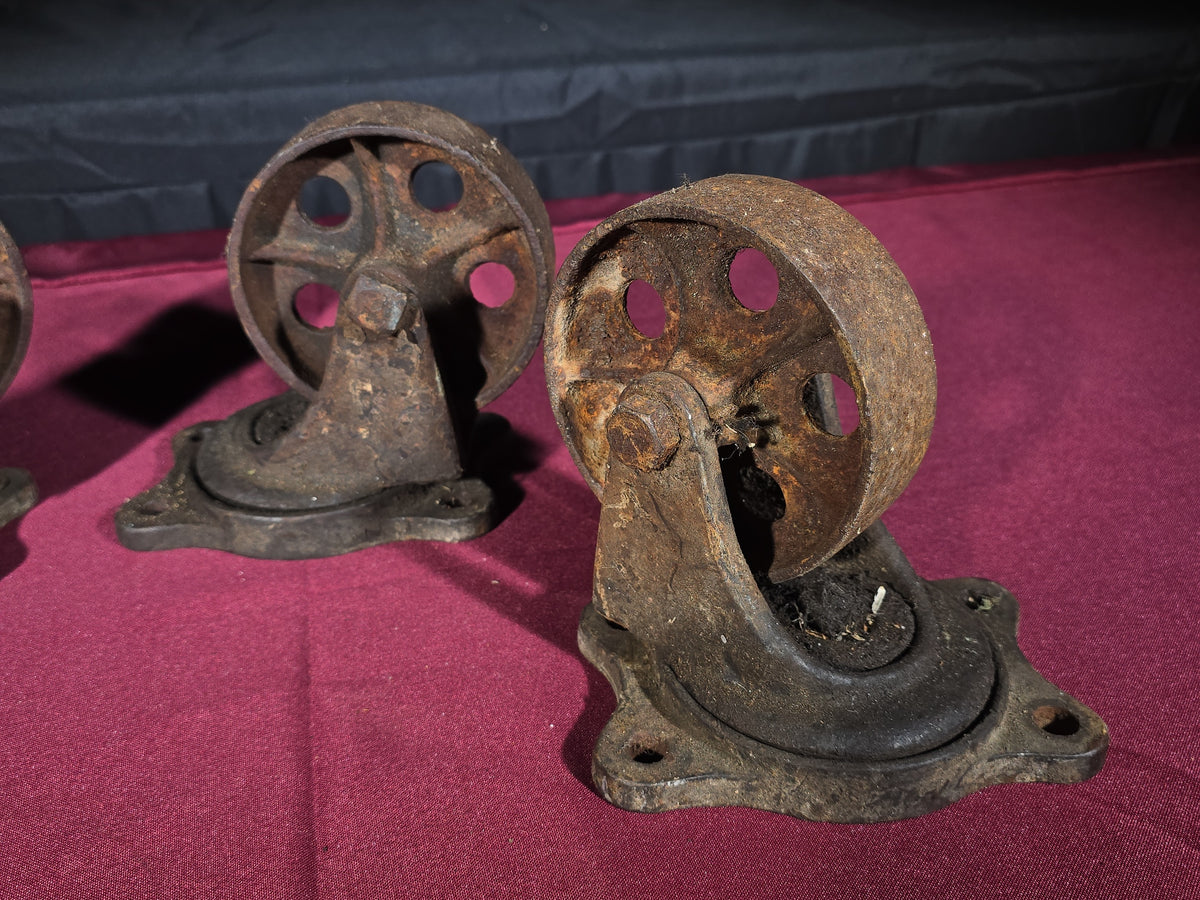 Grouping of Four Antique Cast Iron Industrial Caster Wheels, Manufactured by Service Caster Co., Albion, Michigan