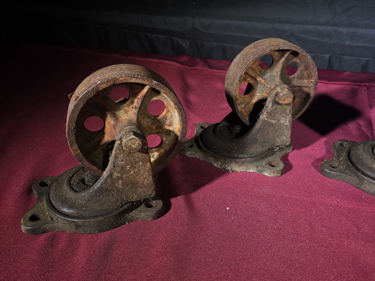 Grouping of Four Antique Cast Iron Industrial Caster Wheels, Manufactured by Service Caster Co., Albion, Michigan