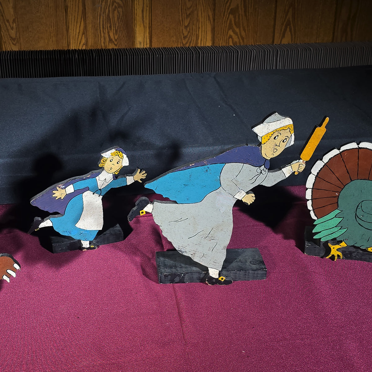 Grouping of Four Vintage Folk Art Hand-Painted Wooden Cutout Figures including Bear, Turkey, and Two Pilgrim Women