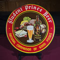 Lot 154 - Vintage Student Prince Beer "Natural Companion of Good Foods" Round Tin Lithograph Advertising Sign, Manufactured by Ludlow Mfg. Co., Cincinnati, Ohio, 16" H