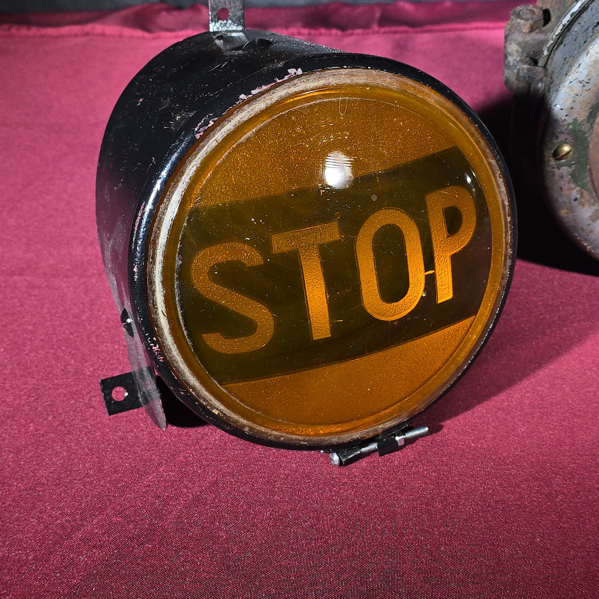 Grouping of Three Antique and Vintage Automotive Lights including Amber "STOP" Lamp, Headlamp, and Red Tail Light with License Plate Bracket