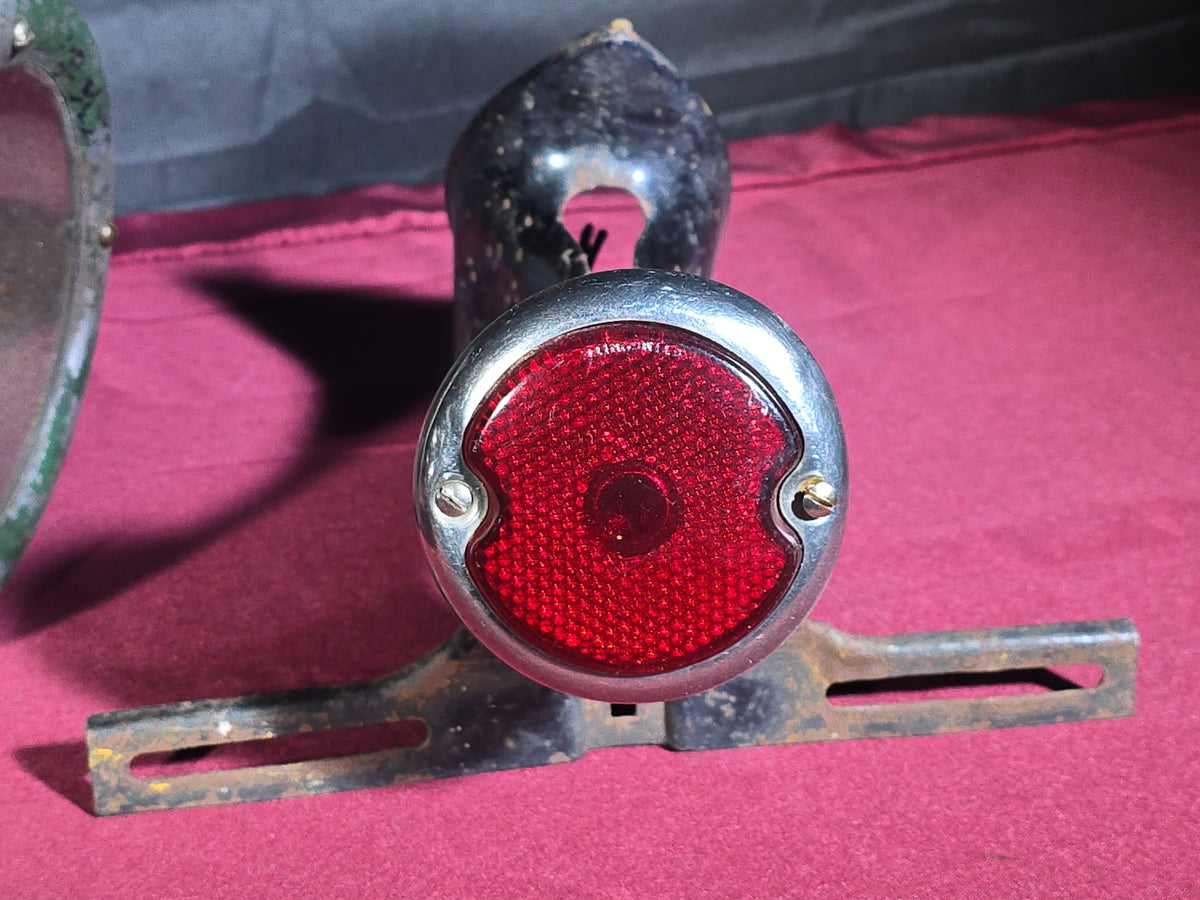 Grouping of Three Antique and Vintage Automotive Lights including Amber "STOP" Lamp, Headlamp, and Red Tail Light with License Plate Bracket
