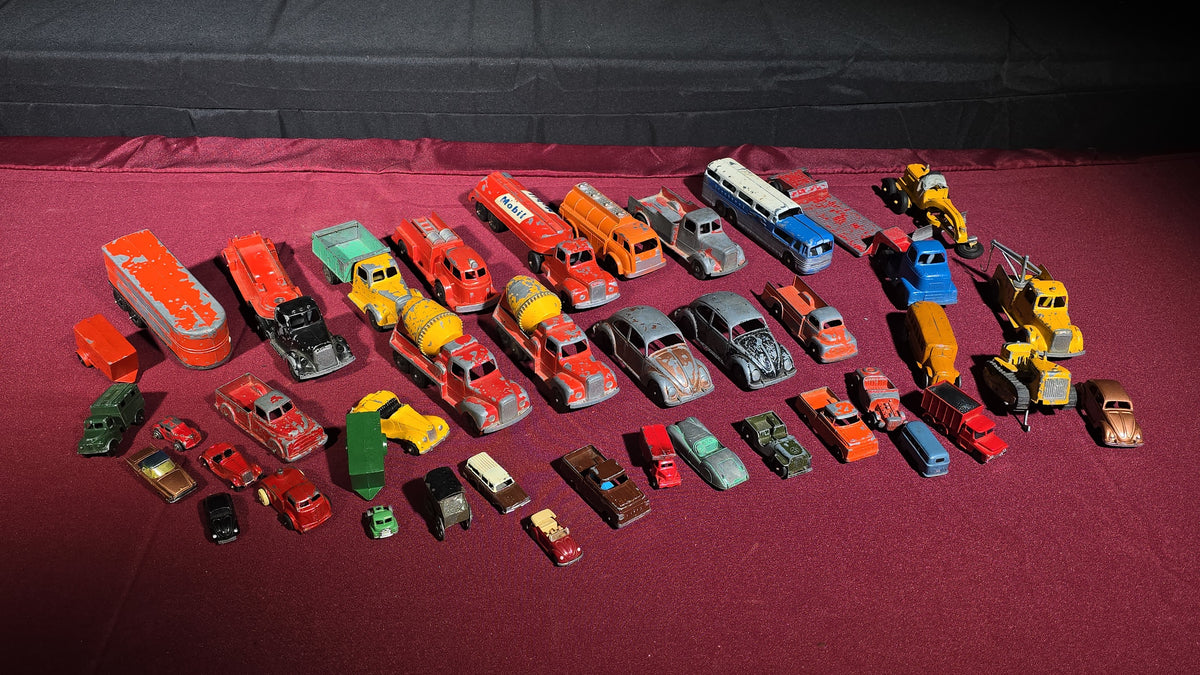 Grouping of Vintage Tootsietoy Die-Cast Vehicles including Cars, Trucks, Tankers, Construction Equipment, and a Greyhound Bus