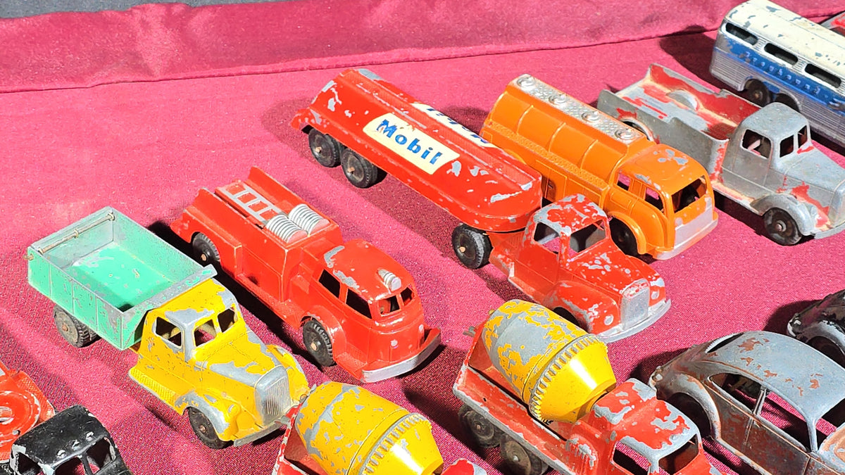Grouping of Vintage Tootsietoy Die-Cast Vehicles including Cars, Trucks, Tankers, Construction Equipment, and a Greyhound Bus