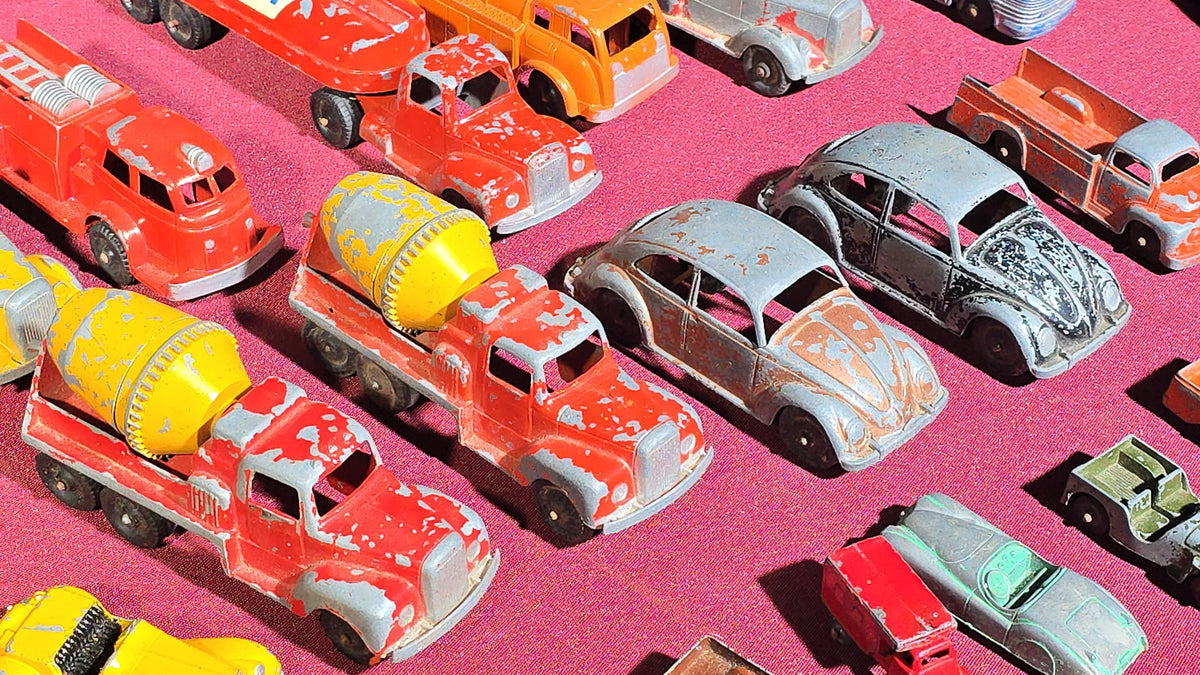 Grouping of Vintage Tootsietoy Die-Cast Vehicles including Cars, Trucks, Tankers, Construction Equipment, and a Greyhound Bus