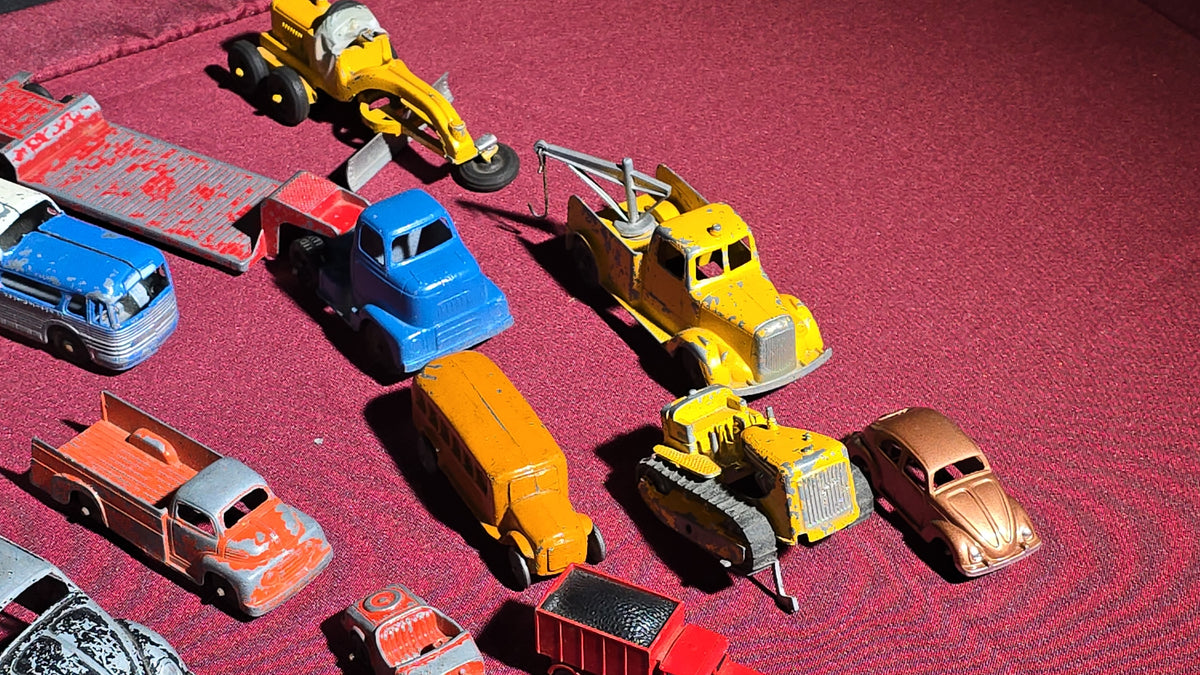 Grouping of Vintage Tootsietoy Die-Cast Vehicles including Cars, Trucks, Tankers, Construction Equipment, and a Greyhound Bus