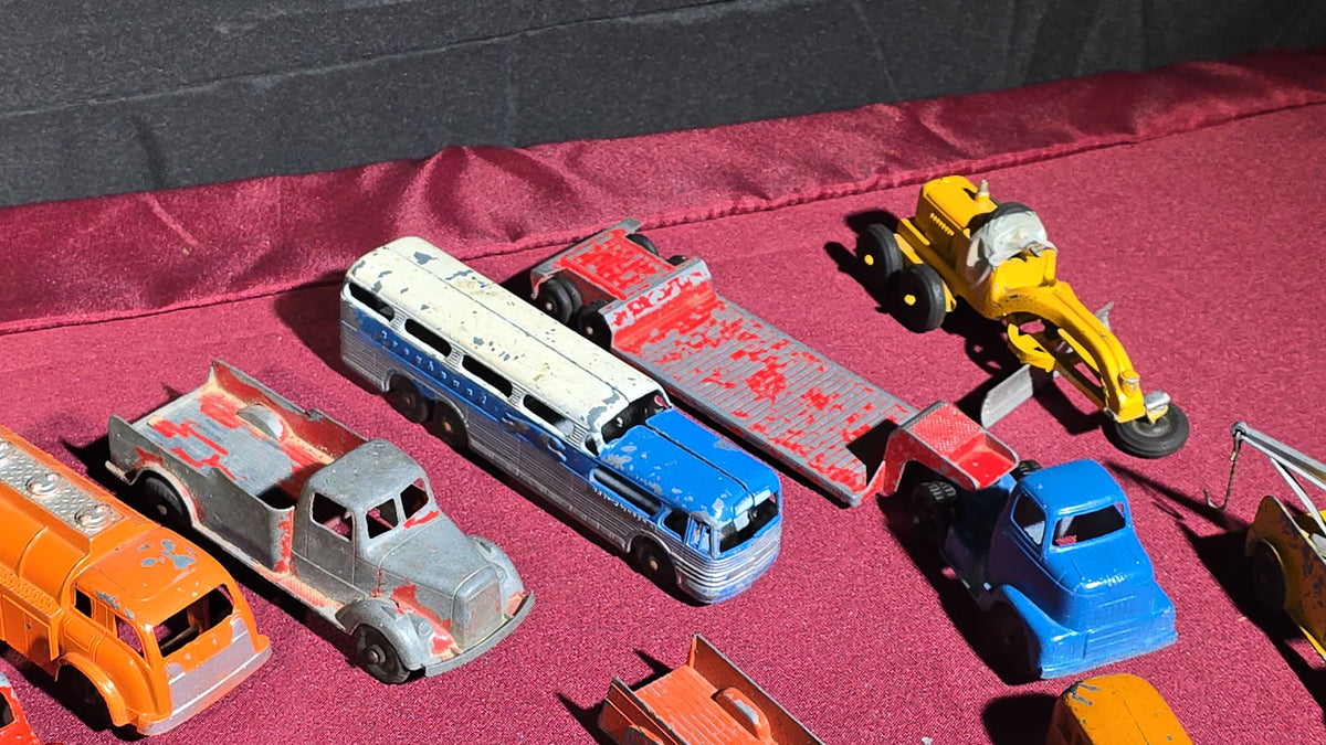 Grouping of Vintage Tootsietoy Die-Cast Vehicles including Cars, Trucks, Tankers, Construction Equipment, and a Greyhound Bus
