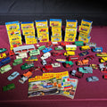 Lot 025 - Vintage Lesney Matchbox Series Diecast Vehicle Collection with 24 Boxed Cars, Loose Vehicles, and Collector's Catalogs, 1960s