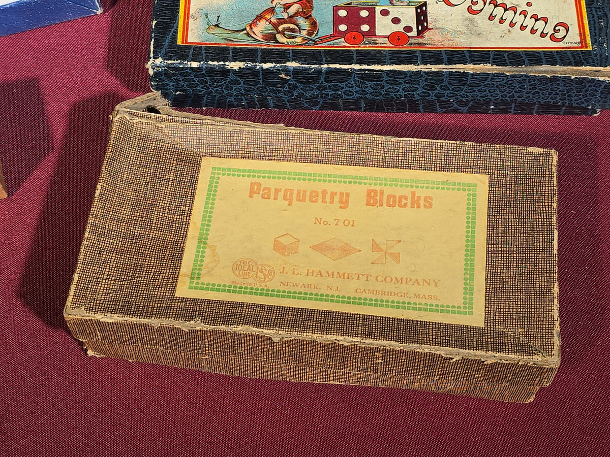 Grouping of Five Antique and Vintage Boxed Items including Embossing Company Checkers, German Domino Set, J. L. Hammett Parquetry Blocks, Glass Salt Cellars, and Pocket Level