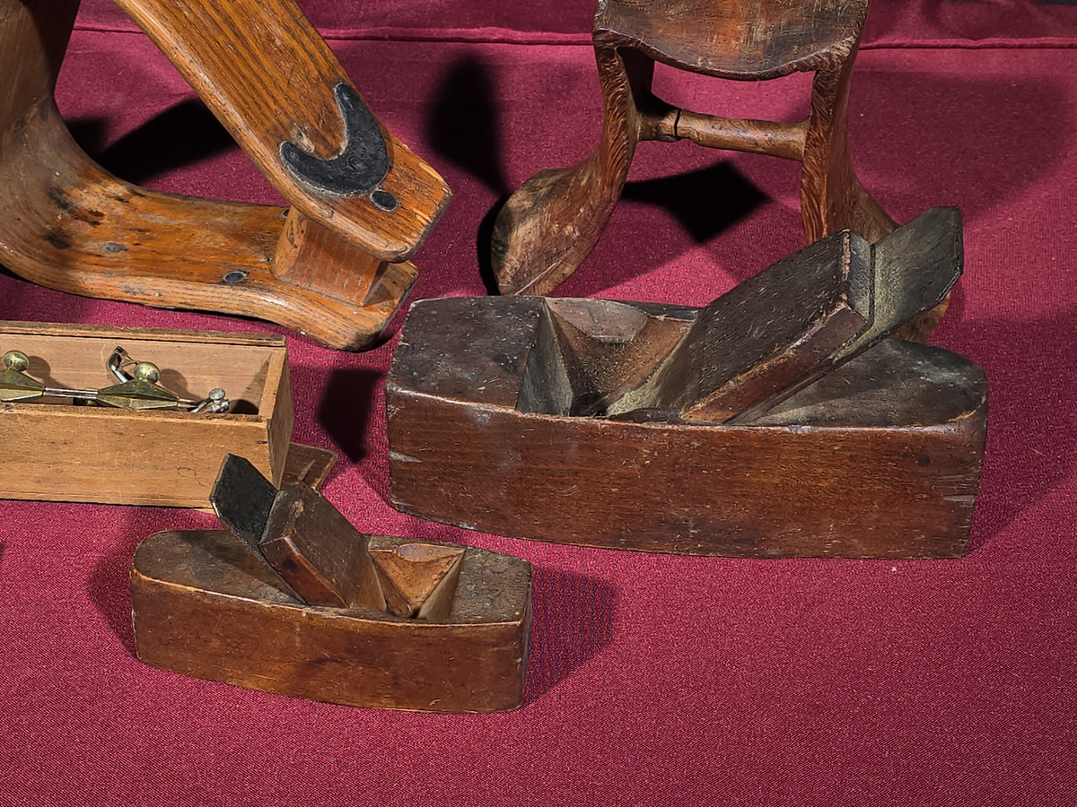 Grouping of Antique and Vintage Wooden Items including Carved Box, Wood Planes, Stirrups, and Brass Balance Scale