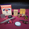 Lot 070 - Grouping of Antique and Vintage Toys and Collectibles Including Monopoly Game, "Lindy" Flying Card Game, Metal Airplane, Wooden Pull Toy, and Dime Register Bank