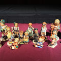 Lot 176 - Grouping of 14 Vintage Goebel Hummel Figurines, Note Chip to Merry Wanderer and Other Various Chips and Wear