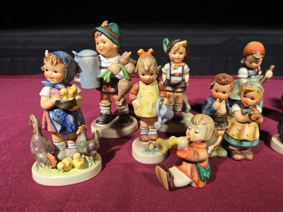 Grouping of 14 Vintage Goebel Hummel Figurines, Note Chip to Merry Wanderer and Other Various Chips and Wear