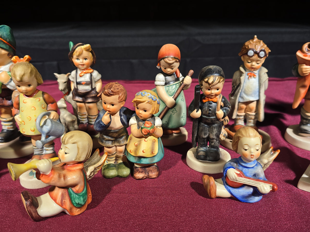 Grouping of 14 Vintage Goebel Hummel Figurines, Note Chip to Merry Wanderer and Other Various Chips and Wear
