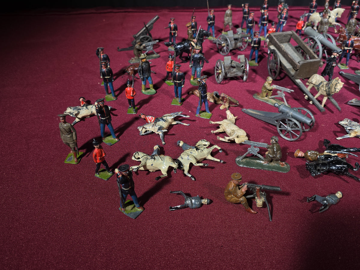 Large Grouping of Antique and Vintage Lead Toy Soldiers, Horses, Cannons, and Artillery including British and French Military Figures
