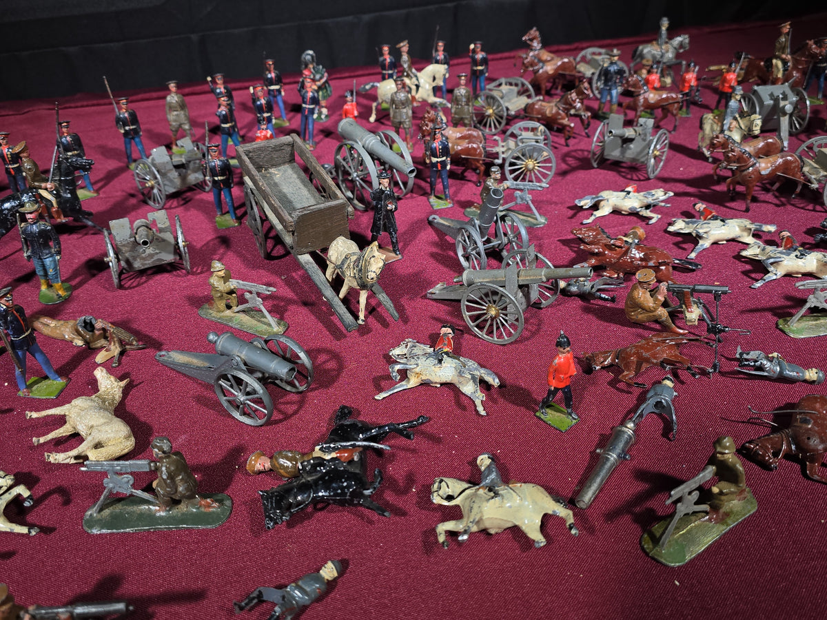 Large Grouping of Antique and Vintage Lead Toy Soldiers, Horses, Cannons, and Artillery including British and French Military Figures