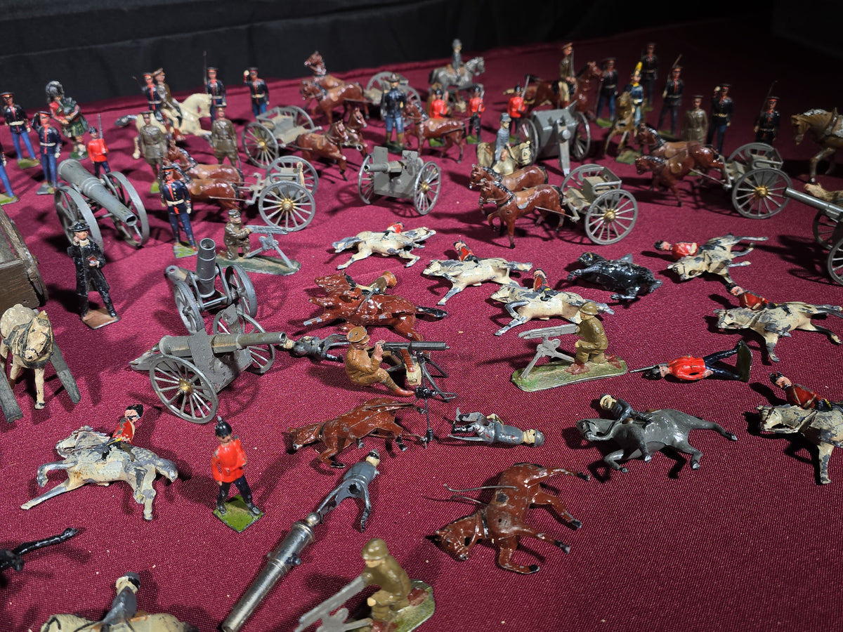 Large Grouping of Antique and Vintage Lead Toy Soldiers, Horses, Cannons, and Artillery including British and French Military Figures