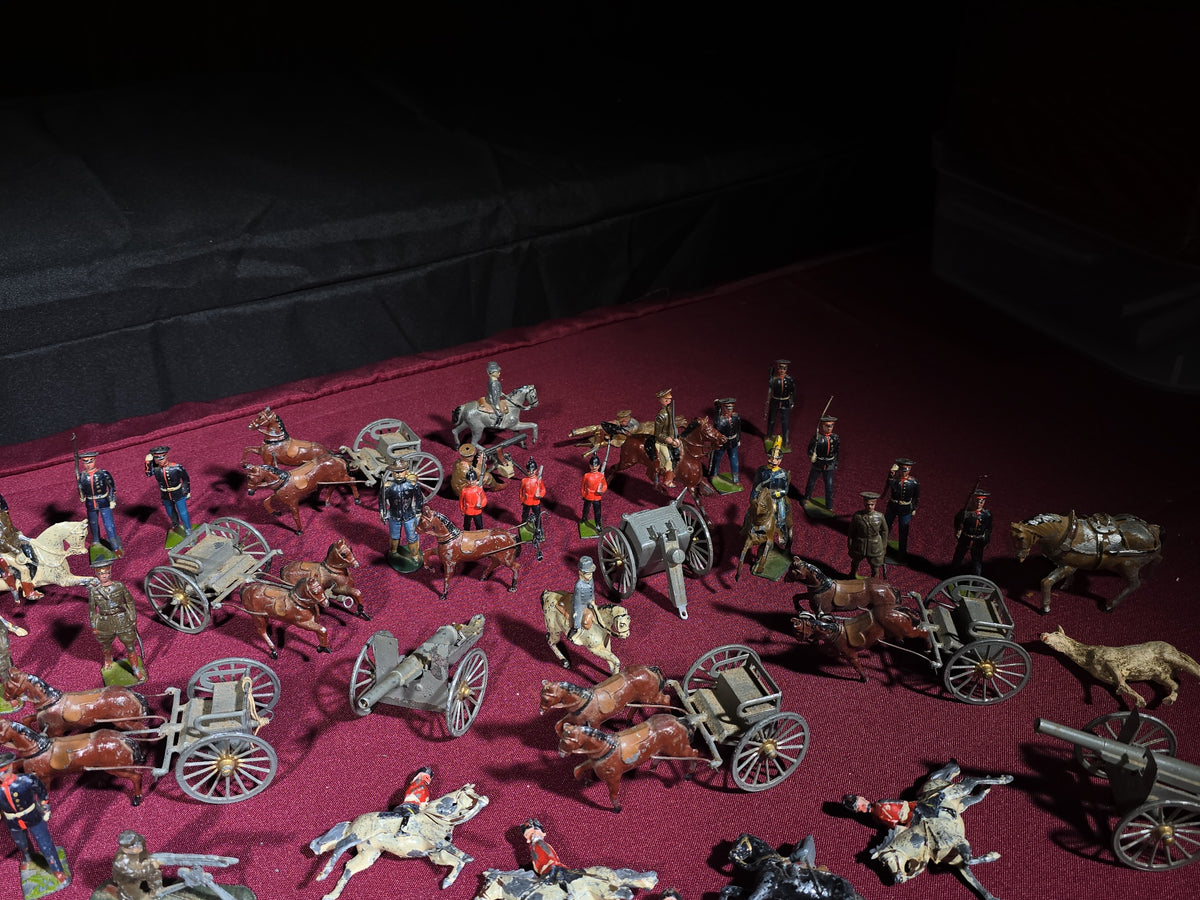 Large Grouping of Antique and Vintage Lead Toy Soldiers, Horses, Cannons, and Artillery including British and French Military Figures