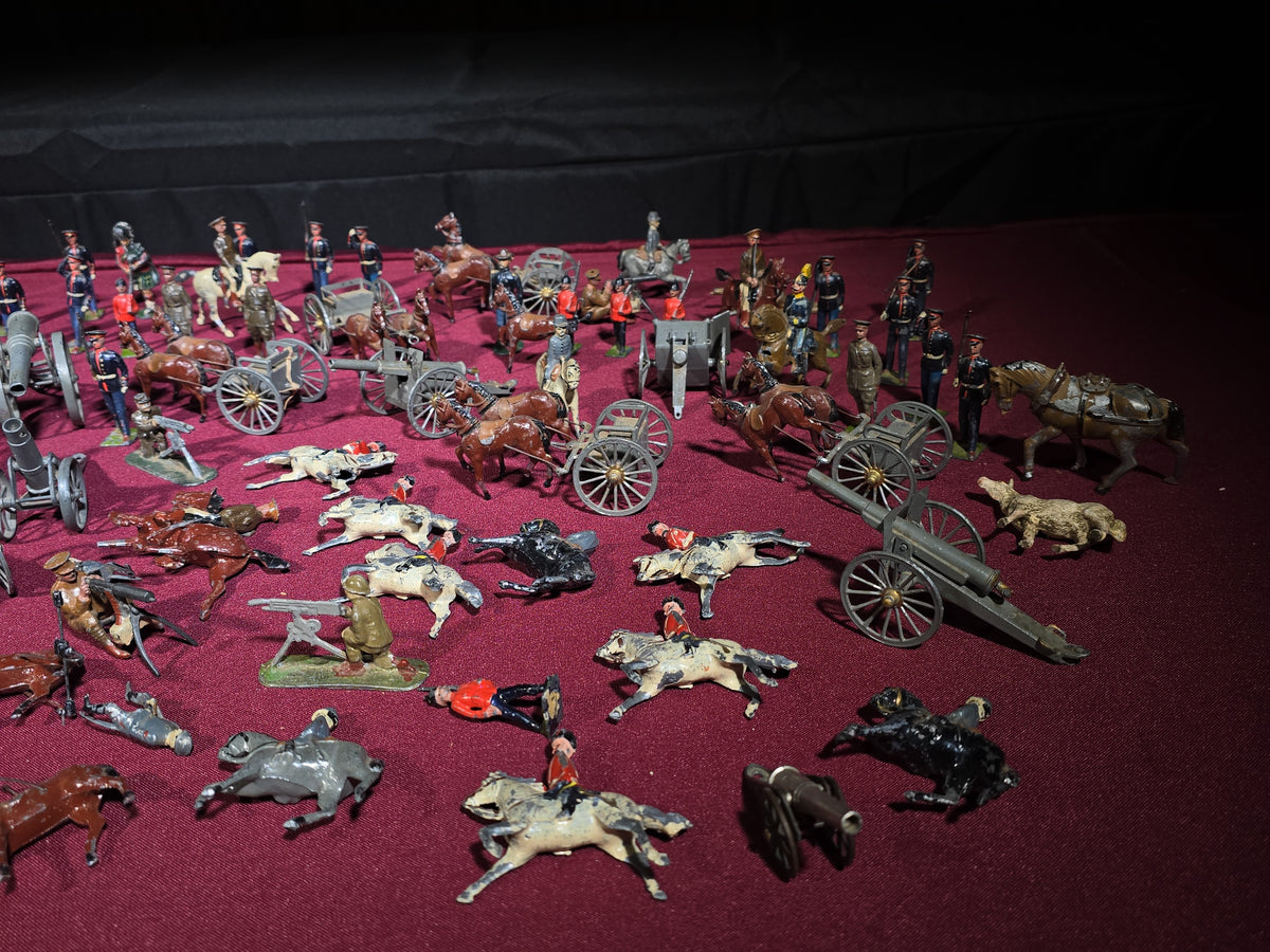 Large Grouping of Antique and Vintage Lead Toy Soldiers, Horses, Cannons, and Artillery including British and French Military Figures
