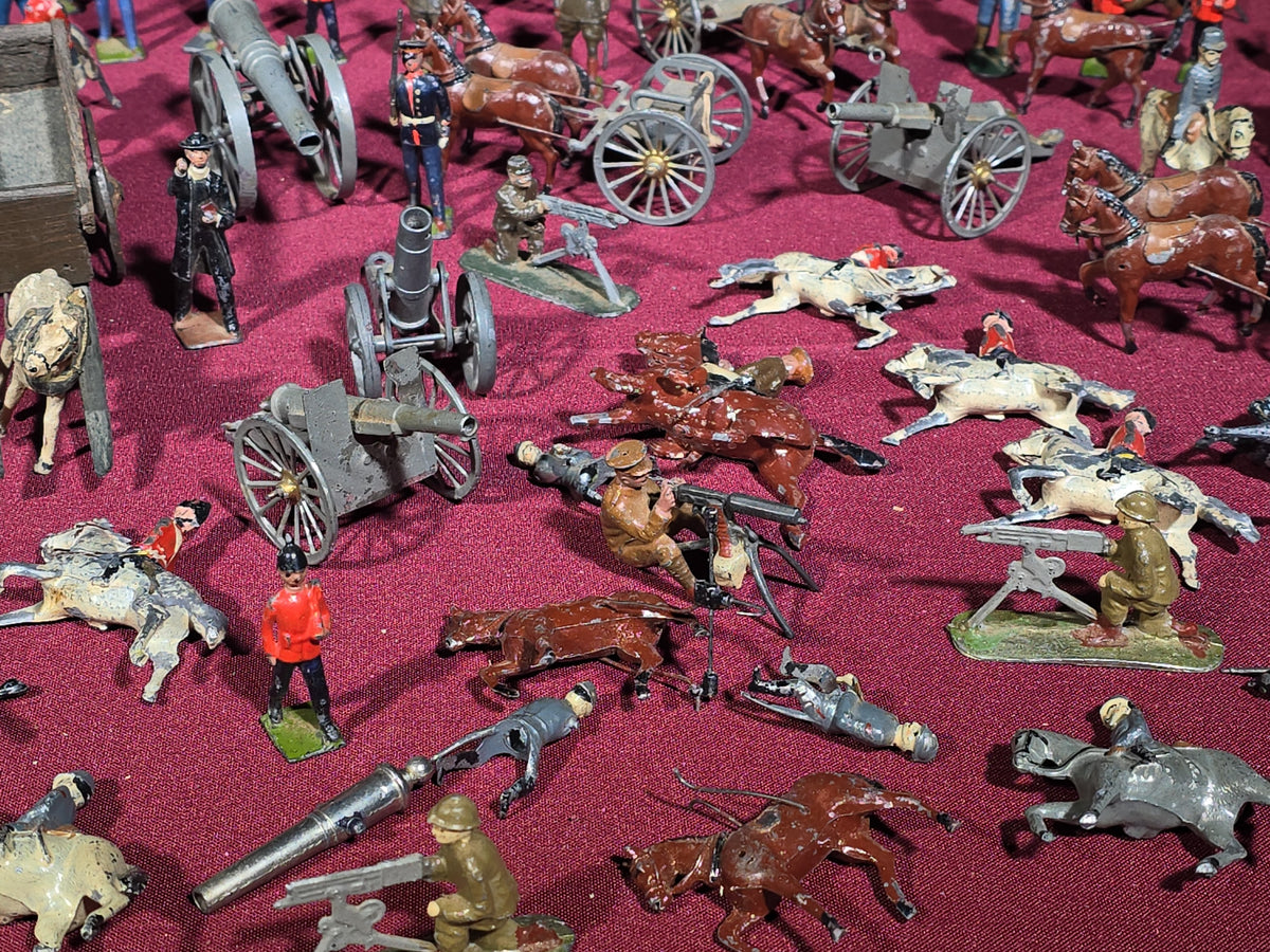 Large Grouping of Antique and Vintage Lead Toy Soldiers, Horses, Cannons, and Artillery including British and French Military Figures