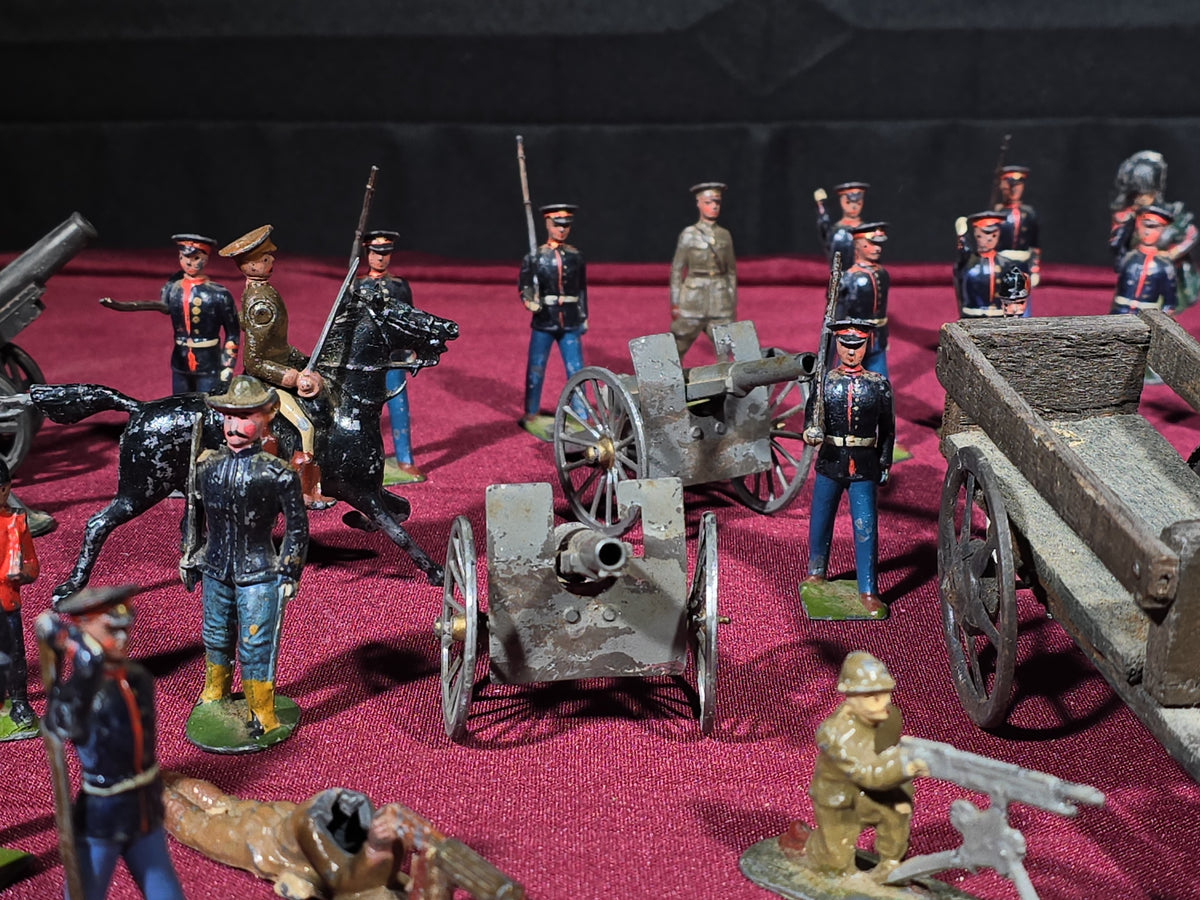 Large Grouping of Antique and Vintage Lead Toy Soldiers, Horses, Cannons, and Artillery including British and French Military Figures