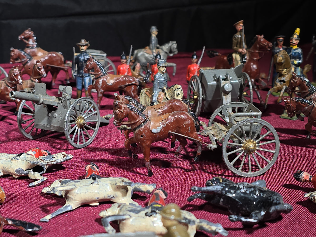Large Grouping of Antique and Vintage Lead Toy Soldiers, Horses, Cannons, and Artillery including British and French Military Figures