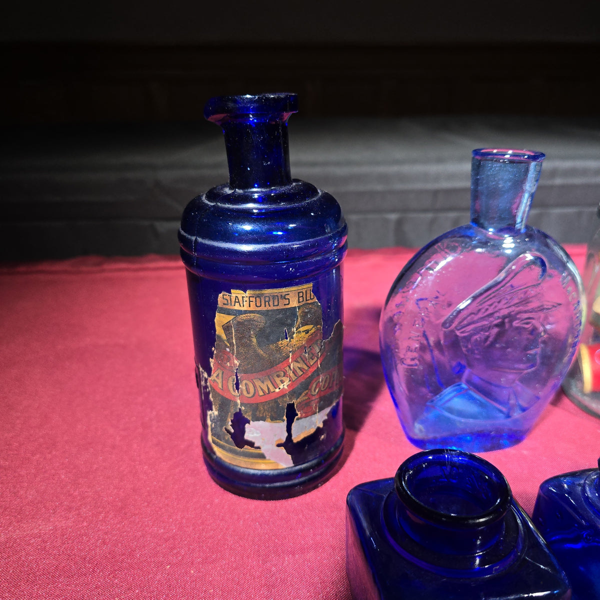 Grouping of Antique and Vintage Bottles including Cobalt Blue Ink Wells, Stafford's Ink, Bromo-Seltzer Emerson Drug Co., and Figural Flask
