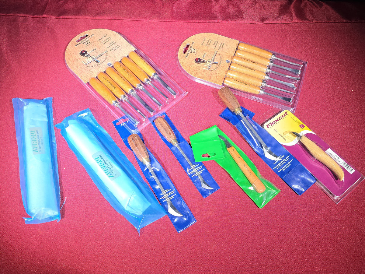 Grouping of Modern Brand New Woodcarving and Woodworking Tools including Two U.J. Ramelson Woodcarving Tool Sets, Auriou Curved Ironing Rasps, Flexcut Mini-Chip Knife, and Woodcraft Carving Knife