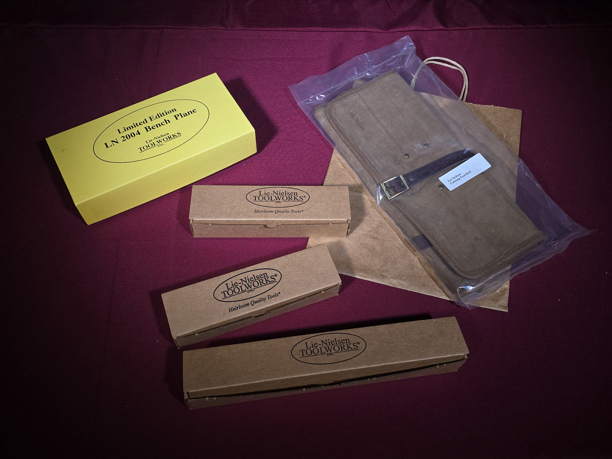 Grouping of Five Modern Brand New Lie-Nielsen Toolworks Tools and Accessories including Limited Edition LN 2004 Bench Plane, Small Bronze Spokeshaves, and Leather Carving Tool Roll, New in Boxes
