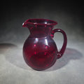 Lot 092 - Vintage Cranberry Glass Miniature Pitcher, Signed by Chet Cole