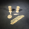Lot 108 - Grouping of Five Antique Carved Bone Pieces Including Pair of Turned Rook Chess Pieces, Openwork Figural Panel, Turned Disc, and Turned Shuttle