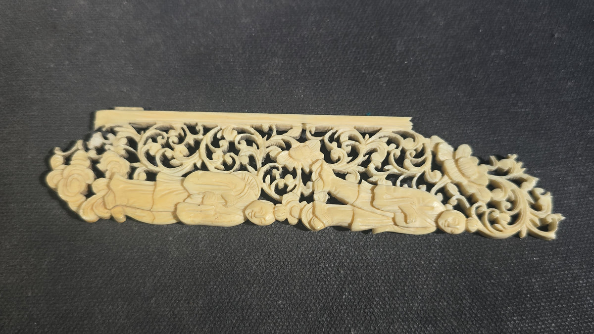 Grouping of Five Antique Carved Bone Pieces including Pair of Turned Rook Chess Pieces, Openwork Figural Panel, Turned Disc, and Turned Shuttle