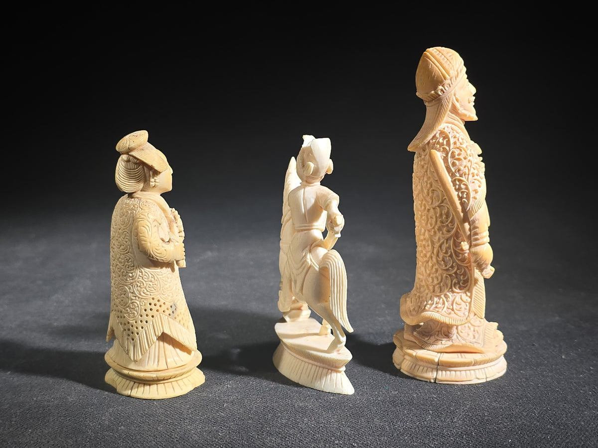 Trio of Antique Carved Ivory Chess Pieces including King, Queen, and Knight