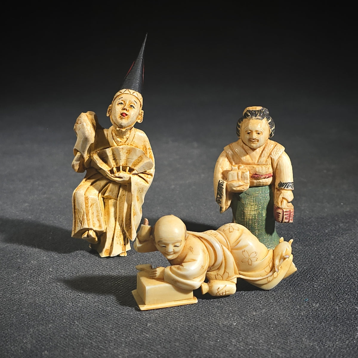 Trio of Antique Japanese Carved and Polychrome-Tinted Ivory Netsuke Figures