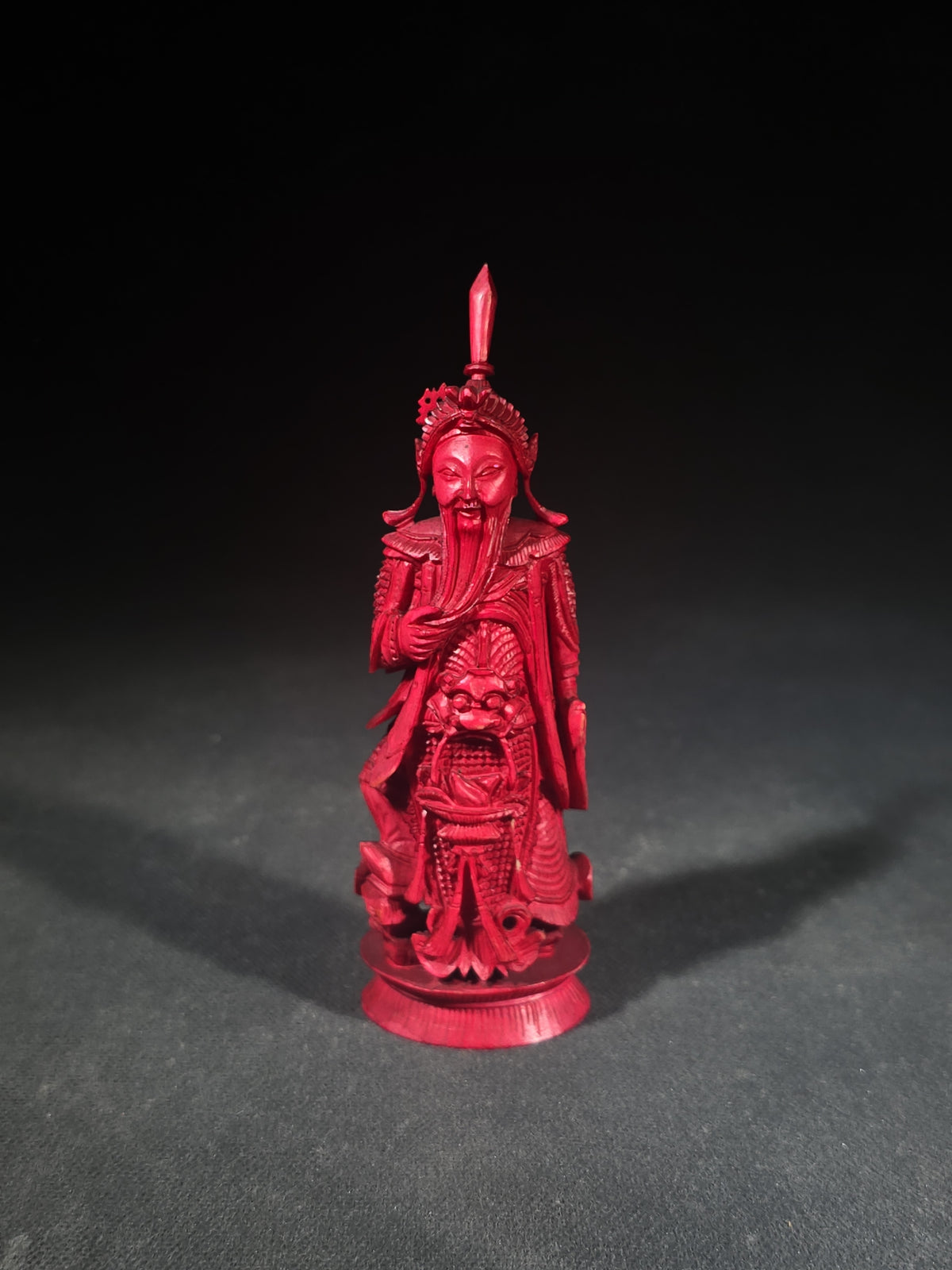 Antique Red-Dyed Carved Ivory Chinese Figural Chess Piece, Bearded Warrior King with Elaborate Headdress and Armor