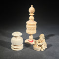 Lot 110 - Trio of Vintage Carved Faux Ivory Pieces Including Turned Finial, Lidded Vessel, and Figural Netsuke-Style Carving