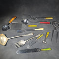 Lot 142 - Grouping of Antique and Vintage Kitchen Utensils and Serving Pieces Including Bakelite-Handled Flatware, Two-Tine Carving Fork, Ladle, and Crumb Comb