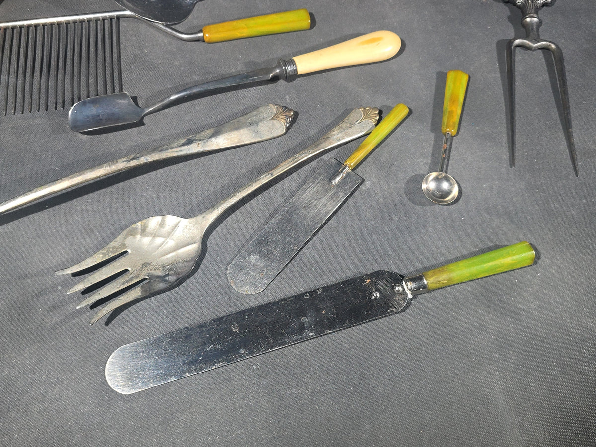 Grouping of Antique and Vintage Kitchen Utensils and Serving Pieces including Bakelite-Handled Flatware, Two-Tine Carving Fork, Ladle, and Crumb Comb