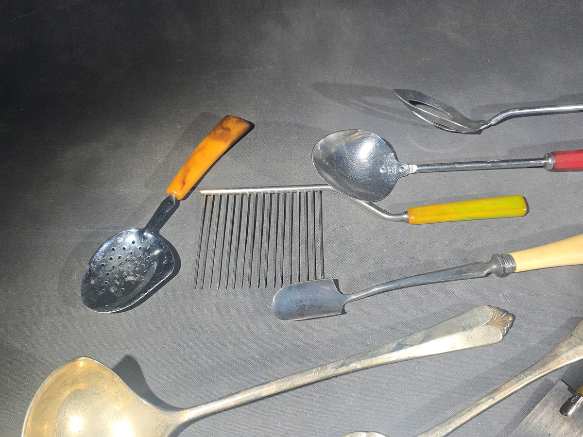 Grouping of Antique and Vintage Kitchen Utensils and Serving Pieces including Bakelite-Handled Flatware, Two-Tine Carving Fork, Ladle, and Crumb Comb