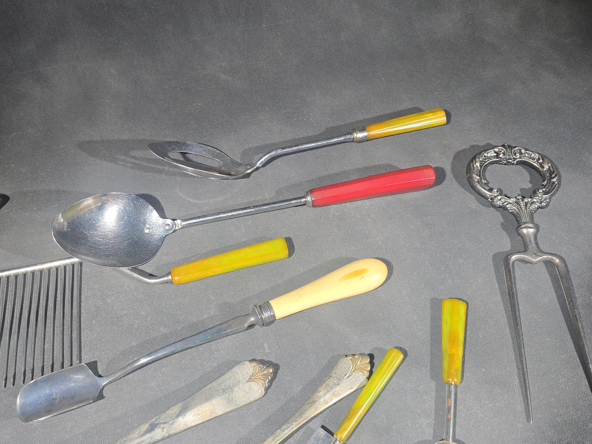 Grouping of Antique and Vintage Kitchen Utensils and Serving Pieces including Bakelite-Handled Flatware, Two-Tine Carving Fork, Ladle, and Crumb Comb