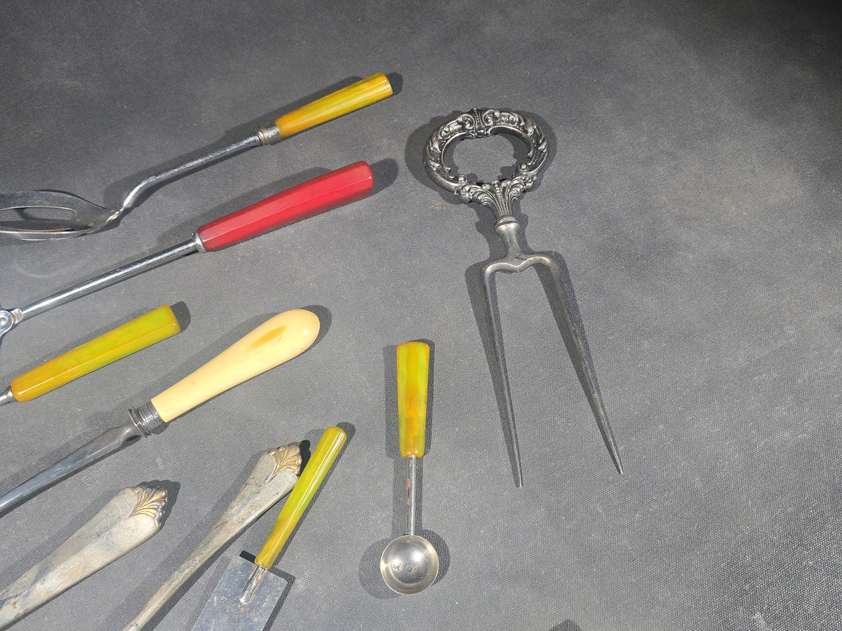 Grouping of Antique and Vintage Kitchen Utensils and Serving Pieces including Bakelite-Handled Flatware, Two-Tine Carving Fork, Ladle, and Crumb Comb
