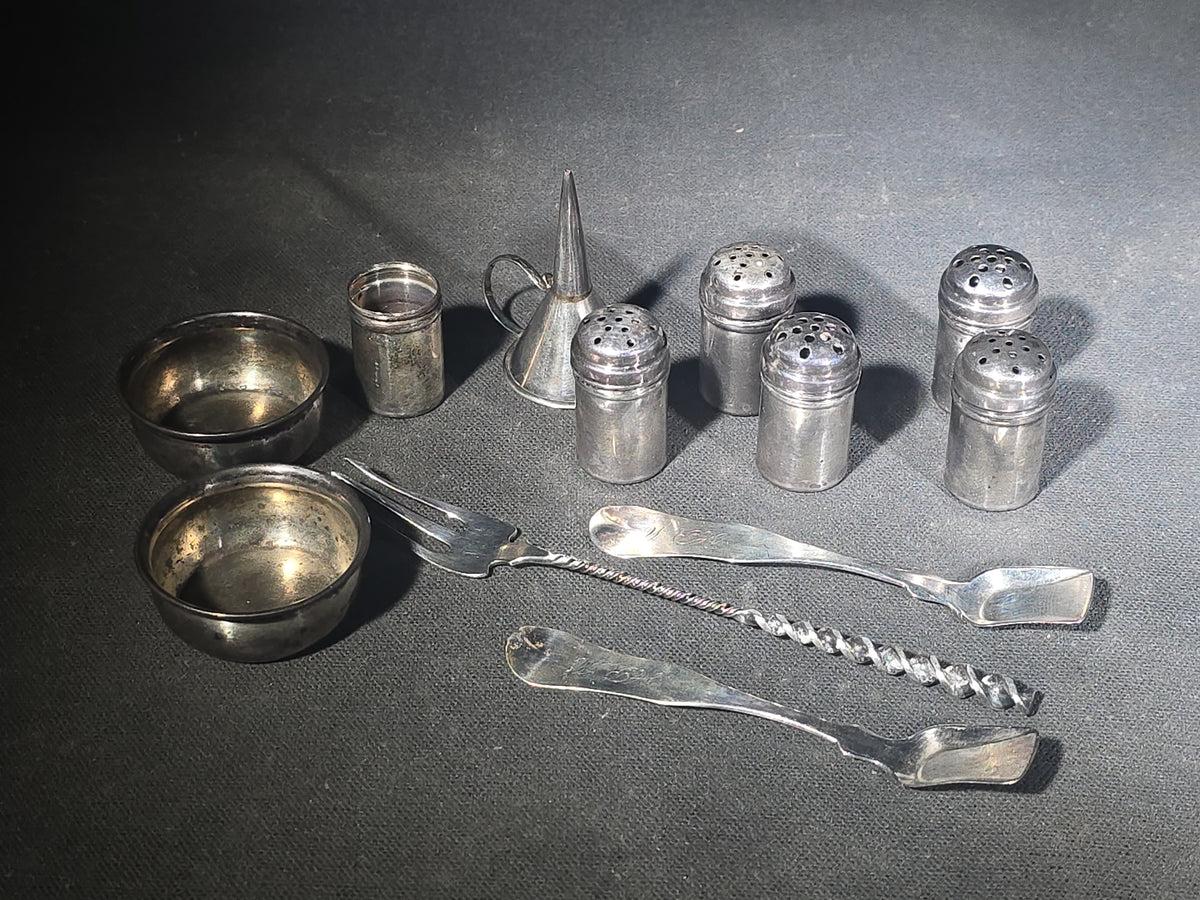Grouping of 11 Sterling Silver Tableware Pieces including Individual Salt Shakers, Open Salt Cellars, Miniature Funnel, Sugar Tongs, and Cocktail Fork