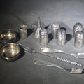 Lot 047 - Grouping of 11 Sterling Silver Tableware Pieces Including Individual Salt Shakers, Open Salt Cellars, Miniature Funnel, Sugar Tongs, and Cocktail Fork, Weight 68 g