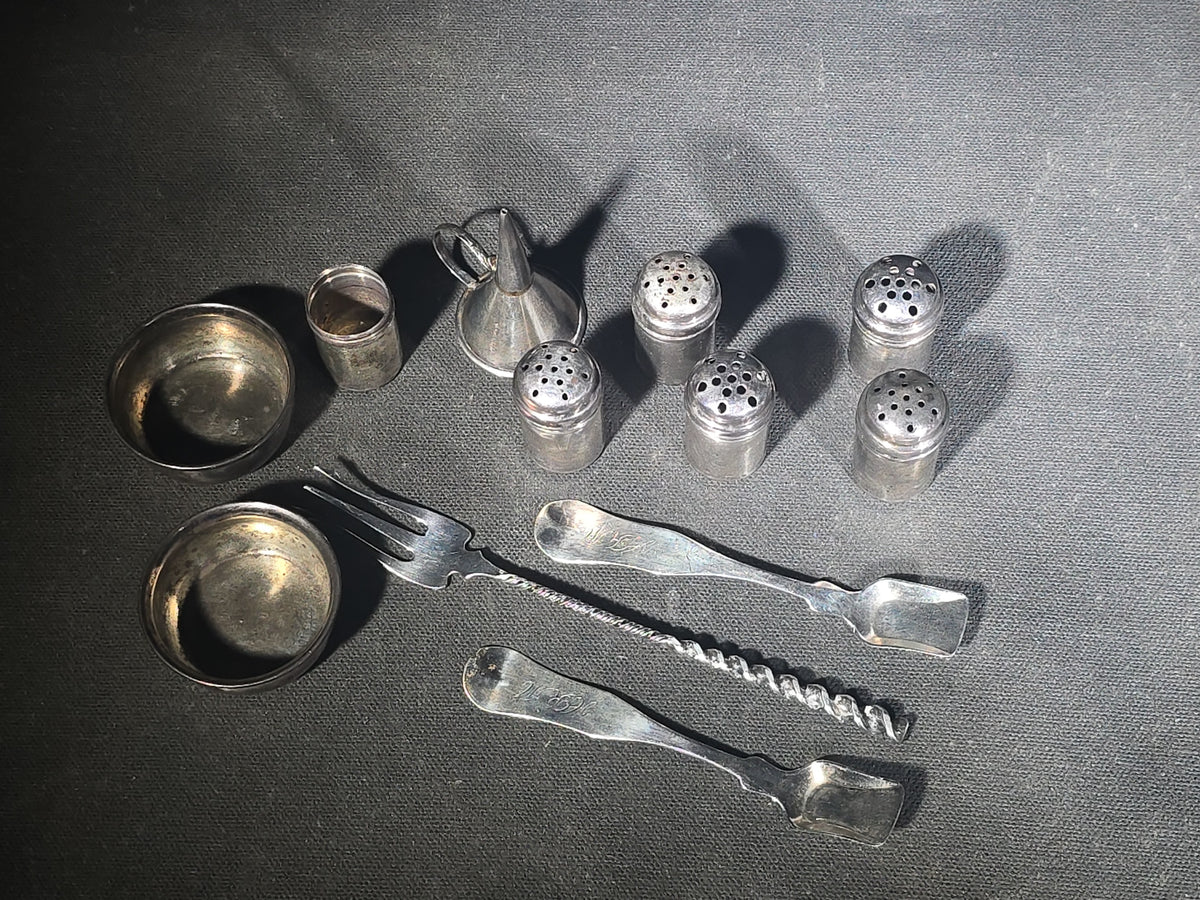 Grouping of 11 Sterling Silver Tableware Pieces including Individual Salt Shakers, Open Salt Cellars, Miniature Funnel, Sugar Tongs, and Cocktail Fork