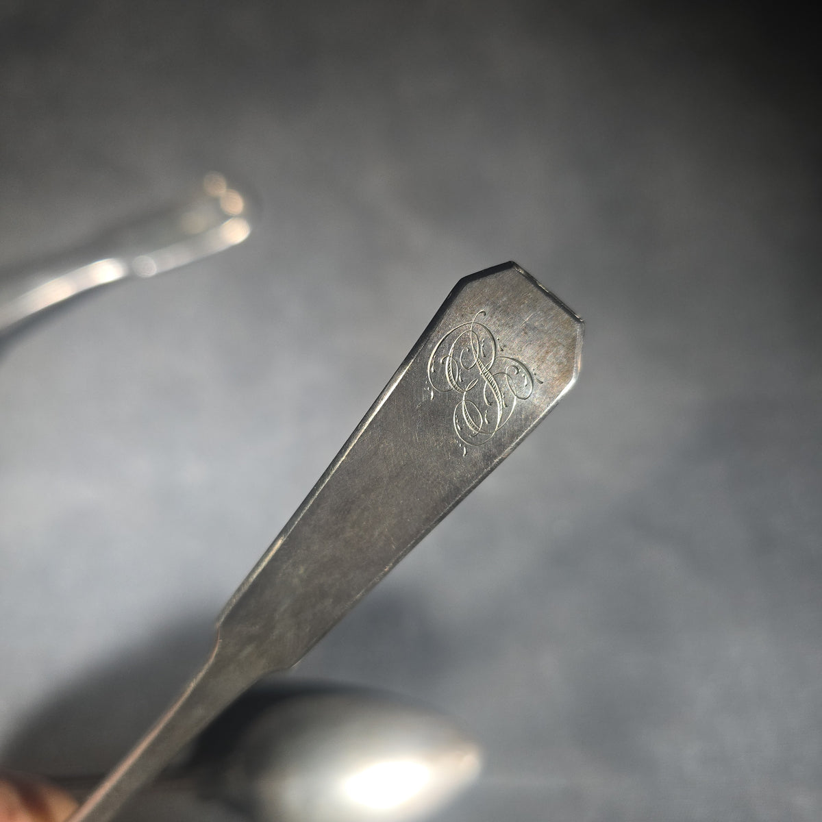Trio of Antique Sterling Silver Flatware Pieces including Two Fiddle-Thread Tablespoons Monogrammed "P" and a Coffin-End Sauce Ladle Monogrammed "C.A.F."