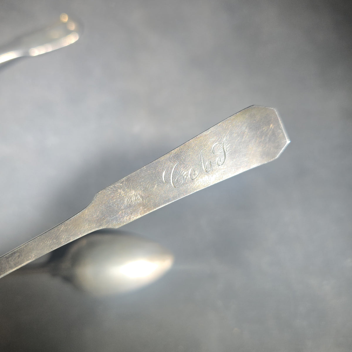 Trio of Antique Sterling Silver Flatware Pieces including Two Fiddle-Thread Tablespoons Monogrammed "P" and a Coffin-End Sauce Ladle Monogrammed "C.A.F."